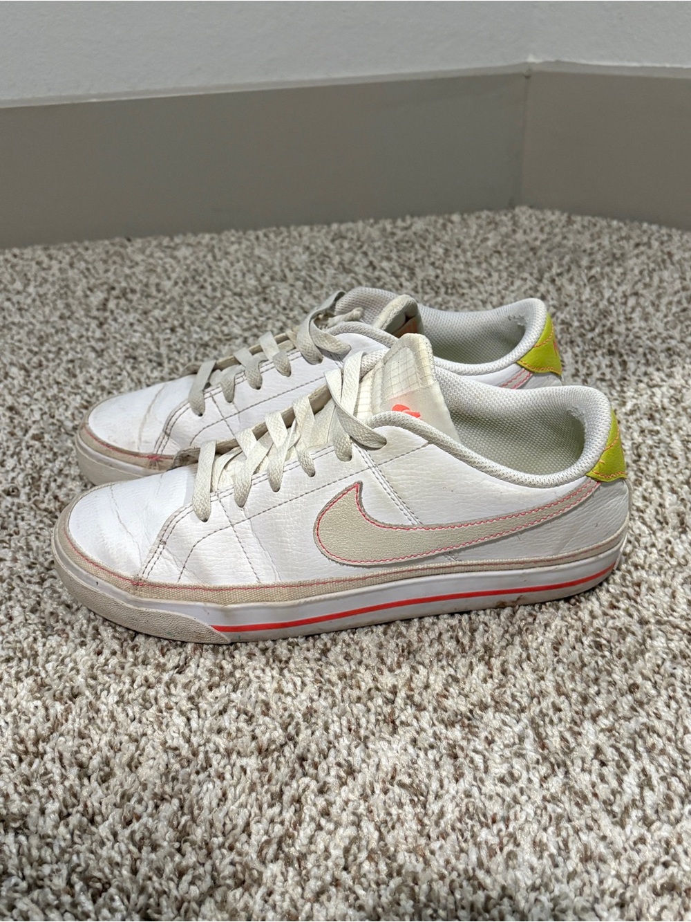Nike White Leather Low-Top Sneakers with Pink Swoosh and Yellow Heel Tab